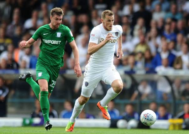 Leading the line: 
Leeds United's Chris Wood gets away from Preston's Paul Huntington in Saturday's game at Elland Road.

Picture: Jonathan Gawthorpe