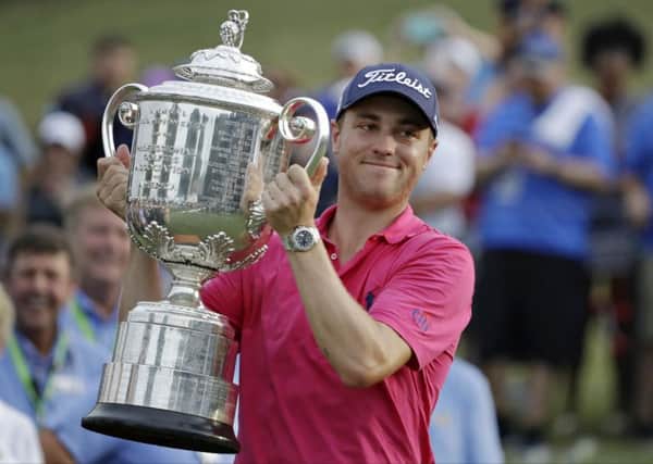 Justin Thomas poses with the Wanamaker Trophy after winning the PGA Championship golf tournament at the Quail Hollow Club Sunday, Aug. 13, 2017, in Charlotte. (AP Photo/Chris O'Meara)
