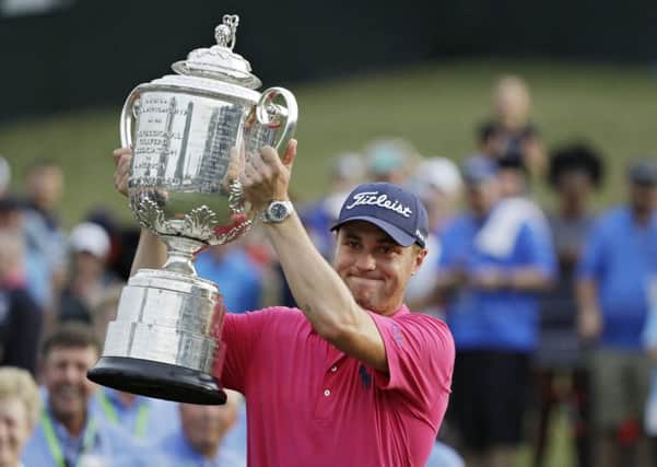 Justin Thomas holds aloft the Wannamaker Trophy (Picture: AP)