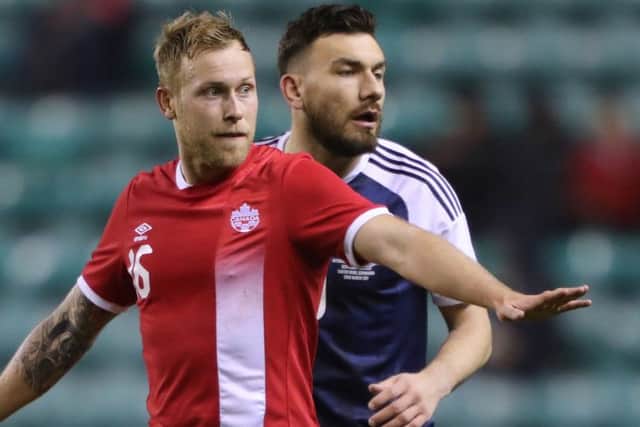 Leaving Hammers?: Scotland's Robert Snodgrass, marked by Canada's Scott Arfield, is attracting interest.