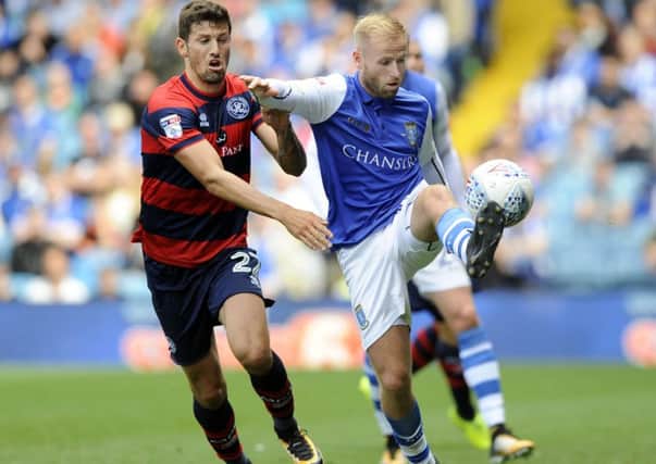 Staying positive: Owls driving force Barry Bannan, with QPR's Pawel Wszolek.
Picture: Steve Ellis