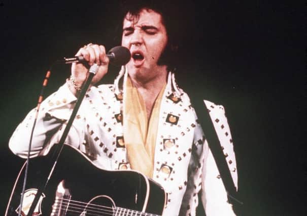 Elvis Presley: The King, seen  during a 1973 concert, who died 40 years ago today. (Picture AP).