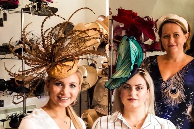 Chloe, left, and Clementine, middle with milliner Jenny Roberts.