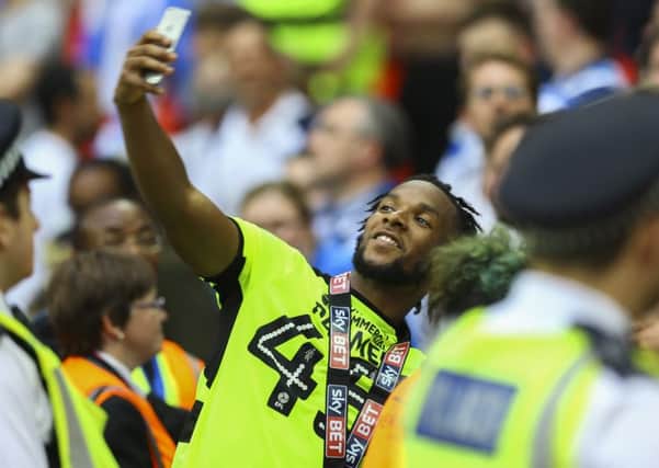 Kasey Palmer takes a selfie with Huddersfield Town fans at Wembley in May (Picture: Jason Brown/JMP).