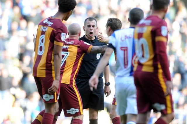 Bradford players remonstrate with the referee