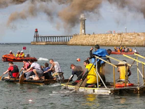 Raft race action at Whitby Regatta . Saturday 18 August. Whitby Regatta 2017. Picture: Ceri Oakes w173002f