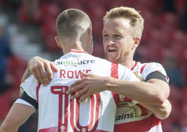Well done: Doncaster Rovers' Tommy Rowe celebrates with James Coppinger after scoring.