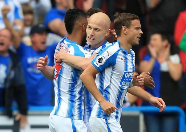Huddersfield Town's Aaron Mooy (centre) celebrates with his team-mates after scoring his side's first goal (Picture: PA)