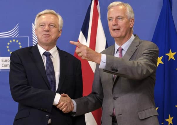 EU chief Brexit negotiator Michel Barnier, right, and British Secretary of State David Davis