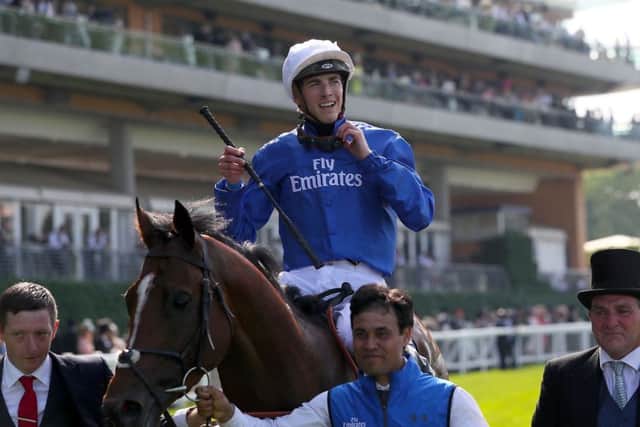 Jockey James Doyle celebrates winning the St James's Palace Stakes with Barney Roy. Picture: Brian Lawless/PA.
