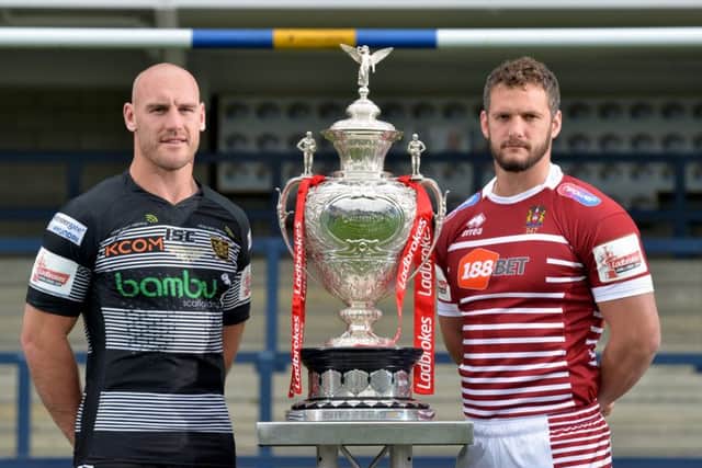 SOMETHING FOR THE WEEKEND: Hull FC captain Gareth Ellis and Wigan skiper Sean O'Loughlin pose with the Challenge Cup trophy.  Picture: Bruce Rollinson