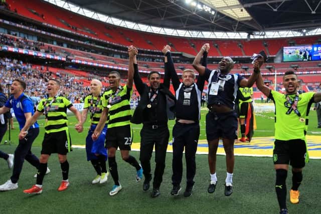 TOGETHERNESS: Huddersfield Town celebrate their Championship play-off final success at Wembley. Picture: Mike Egerton/PA