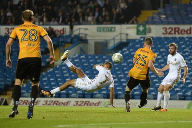 Kemar Roofe scored with a bicycle kick to seal his hat-trick in the second half