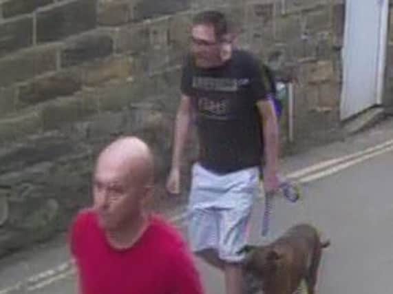 Police want to trace two men after a boy was attacked by a dog