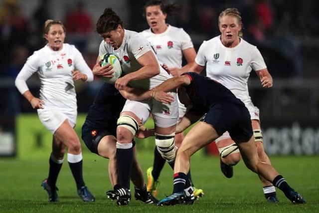 England's Sarah Hunter is tackled by France's Elodie Poublan (left) and Caroline Ladagnous. Picture: Brian Lawless/PA