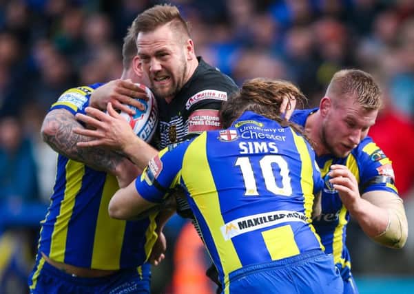 Up for the battle: Liam Watts, pictured fighting his way through a host of Warrington defenders recently, is conscious of a dangerous Wigan with little other than Challenge Cup silverware to play for. (Picture: SWPix.com)