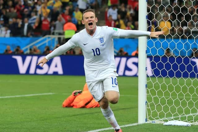Wayne Rooney celebrates scoring at the 2014 World Cup . Picture: Nick Potts/PA.