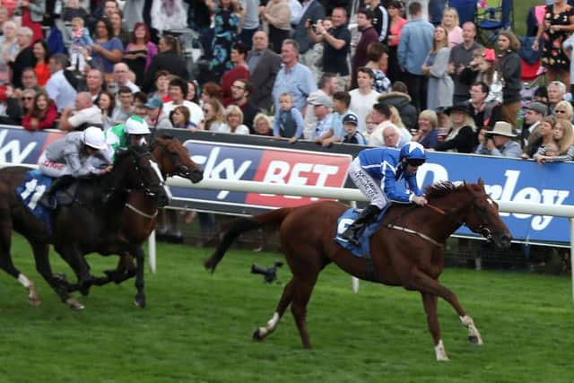 Flaming Spear ridden by Robert Winston (right) wins The Clipper Logistics Stakes at York's Ebor Festival on Thursday. Picture: Simon Cooper/PA