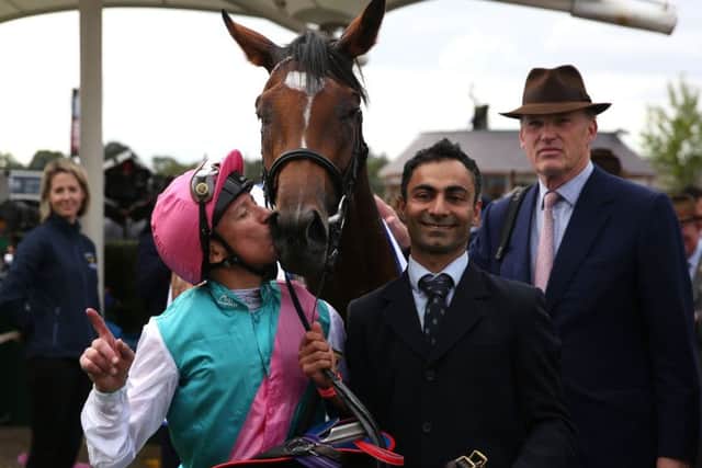 Frankie Dettori kisses Enable after winning The Darley Yorkshire Oaks at York's Ebor Festival on Thursday with trainer John Gosden, far right, watching on. Picture: Simon Cooper/PA