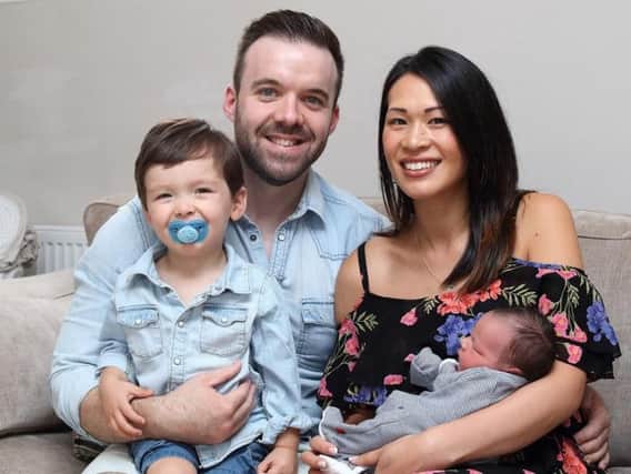 Rebecca Cheung gave birth on the fast lane of the M1. Pictured with Anthony Marks, Harvey Marks and Archie Marks.