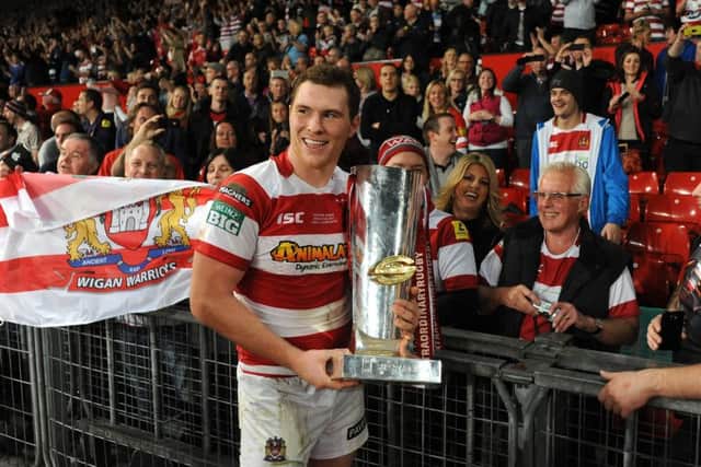 Scott Taylor, pictured with the Super League Grand Final Trophy after winning it with Wigan in 2013 - the same year he won the Challenge Cup against Hull FC.