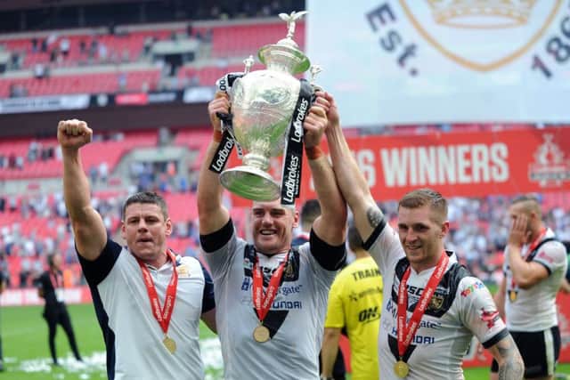 SAME AGAIN PLEASE: 
Hull's Lee Radford, Gareth Ellis and Marc Sneyd celebrate last year's Challenge Cup Final success.
 Picture: Jonathan Gawthorpe.