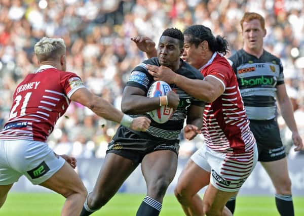 GRAND OCCASION: Hull FC's Masi Matonga breaks into the arms of Lewis Tierney and Taulima Tautai earlier this season. 
Picture: Bruce Rollinson.