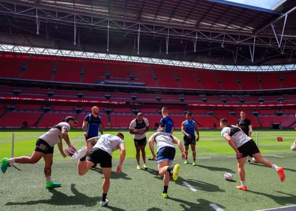 Getting acclimatised: Hull FCs players conduct light drills on the Wembley pitch ahead of todays bid to  win the Challenge Cup for a second successive year. In their way are slight favourites Wigan Warriors, 19 times Cup winners. (Picture: John Walton/PA Wire)