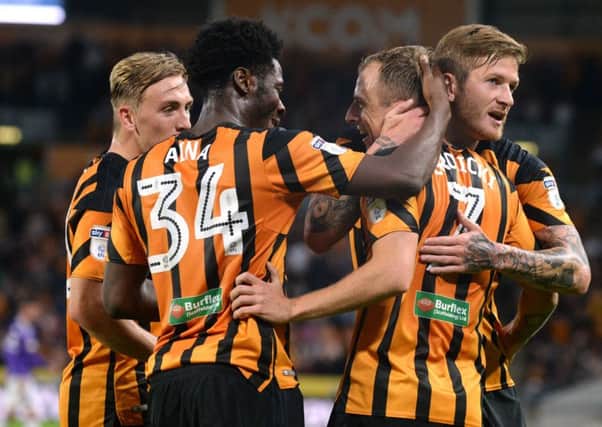 Kamil Grosicki is congratulated by Hull City team-mates after scoring their third goal in the 4-0 home win over Bolton Wanderers last night (Picture: Bruce Rollinson).