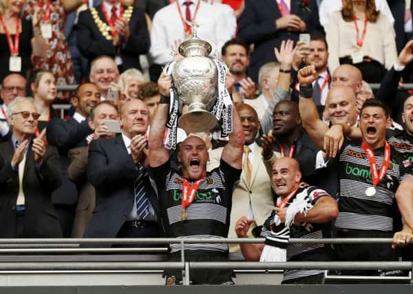 IT'S OURS: Hull FC's Gareth Ellis lifts the trophy. PIC: PA
