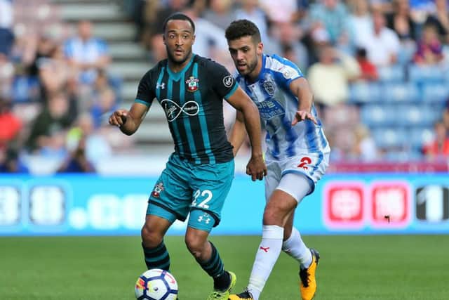 Southampton's Nathan Redmond (left) and Huddersfield Town's Tommy Smith in action during the Premier League match at the John Smith's Stadium, Huddersfield.(Pictures: PA)