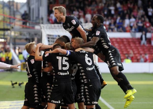 Victory sealed: Leeds players celebrate after Gianni Alioski's goal.
Picture: Simon Hulme