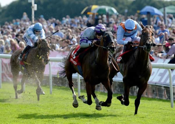 Nakeeta ridden by Callum Rodriguez (centre) beats Flymetothestars ridden by Luke Morris to win the Betfred Ebor during day four of the 2017 Yorkshire Ebor Festival at York Racecourse (Pictures:: Anna Gowthorpe/PA Wire)