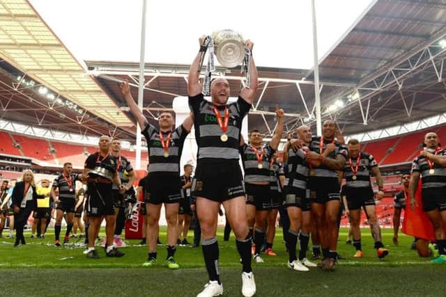 Gareth Ellis of Hull FC lifts the Challenge Cup trophy (Picture: Richard Blaxall/SWpix.com)
