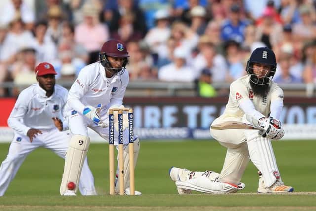 England's Moeen Ali sweeps during day four against West Indies at Headingley. Picture: Nigel French/PA.