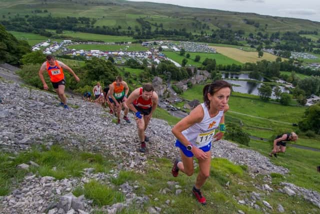 Competitors taking part in the Kilnsey Crag Race.