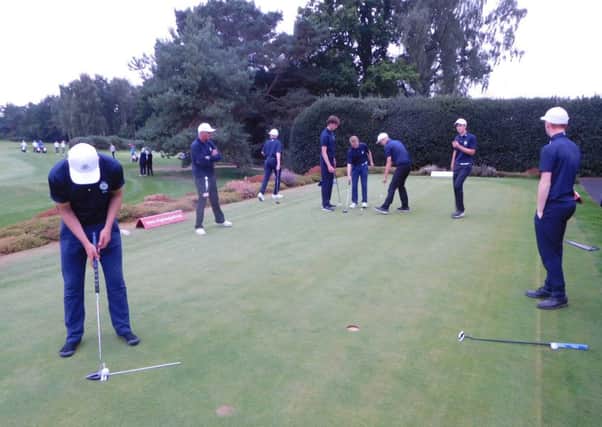 Yorkshire Boys' team busy at work on the practice green at Northamptonshire County GC.
