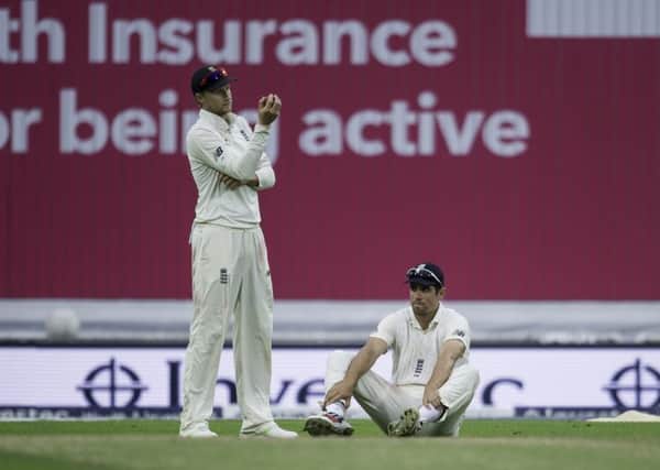 England captain Joe Root and Alastair Cook look dejected after the latter dropped a regulation slip catch that proved key in the West Indies win at Headingley (Picture: Allan McKenzie/SWpix.com).