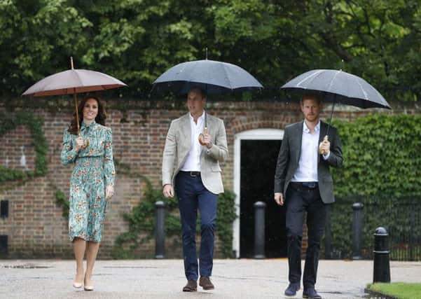 The Duke and Duchess of Cambridge and Prince Harry arrive for a visit to the White Garden in Kensington Palace