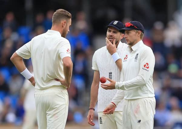 England's captain Joe Root (right) talks to Stuart Broad (left) and James Anderson (centre) on day five at Headingley. Picture: Nigel French/PA