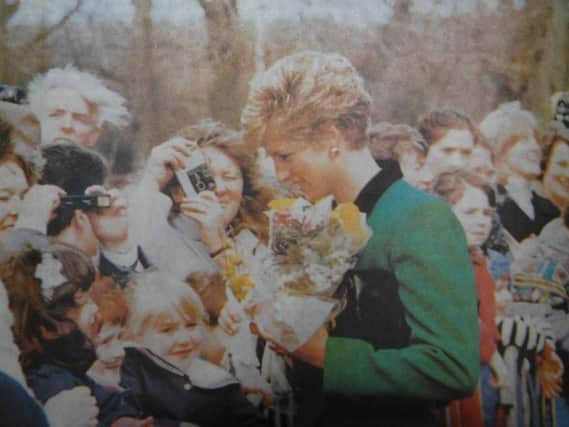 Princess Diana receives flowers as she is welcomed to Harrogate in 1991