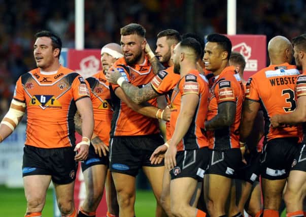 Castleford Tigers, seen celebrating a Mike McMeeken try against Wakefield last month, have enjoyed a remarkable season.  Picture: Jonathan Gawthorpe