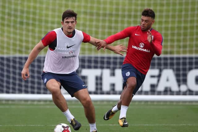 England's Harry Maguire (left) swapped Hull City for Leicester City (Picture: PA)