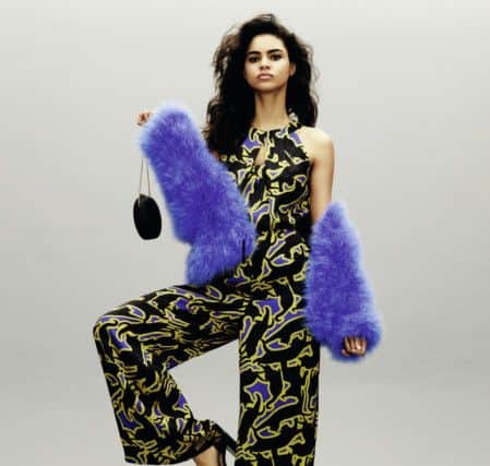 Issa printed jumpsuit, Â£129; marabou jacket, Â£149; clutch, Â£29. All at House of Fraser