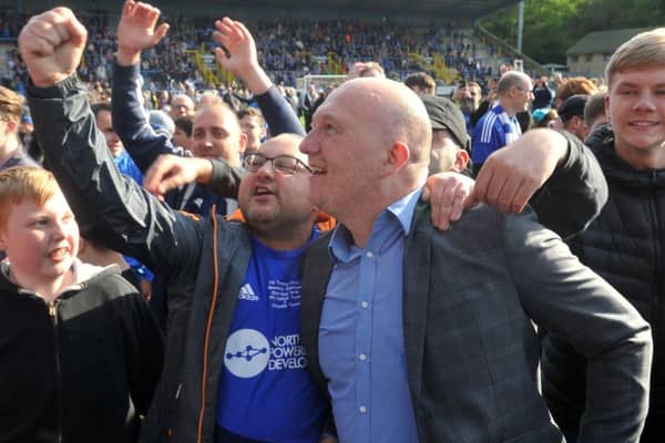 Halifax Town manager Billy Heath celebrates with supporters after last seasons play-off triumph (Picture: Tony Johnson).