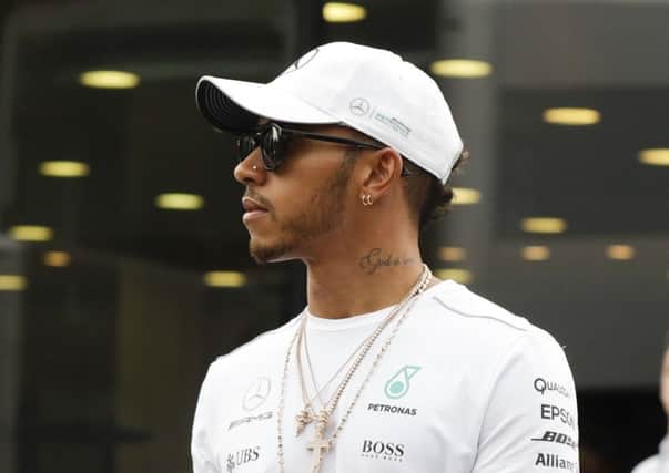 Mercedes driver Lewis Hamilton of Britain walks in the paddock, at Monza racetrack. Picture: AP/Luca Bruno