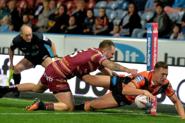Greg Eden dives over for the Tigers' third try.