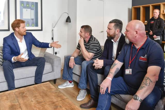 Prince Harry during his visit to the Walking With The
Wounded hub for ex-service personnel making the transition back to civilian life in Manchester.