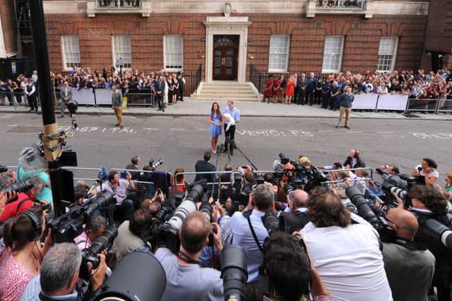 The Duke and Duchess of Cambridge outside the Lindo Wing of St Mary's Hospital in London, with Prince George, in 2013
