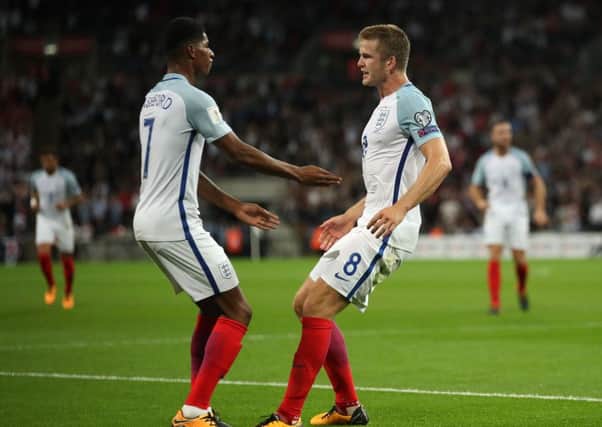 England's Eric Dier celebrates scoring the hosts' first goal of the game with Marcus Rashford. Picture: Nick Potts/PA